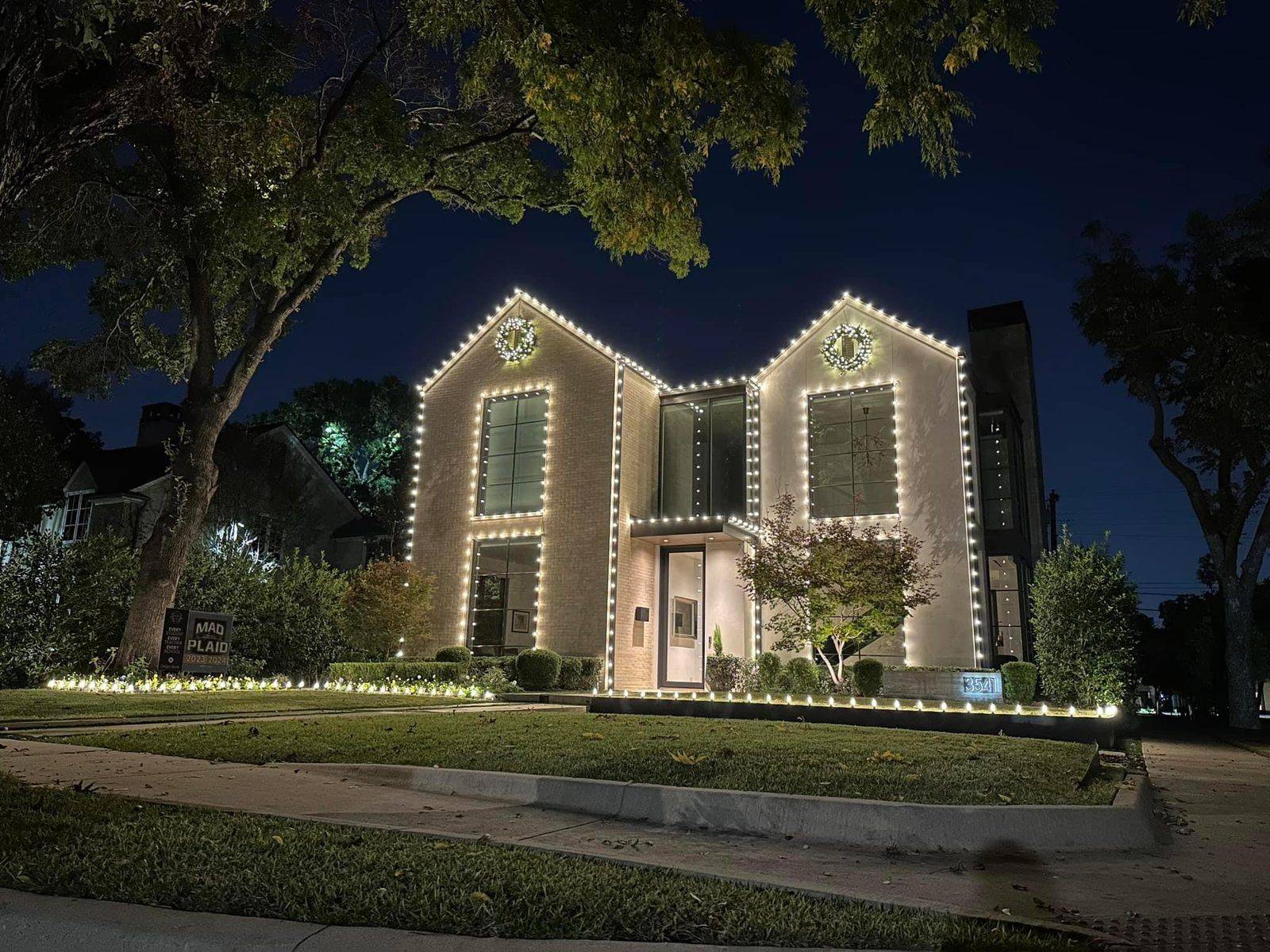 Recent Highland Park TX Christmas light installation on a modern home with C9 LED roofline
