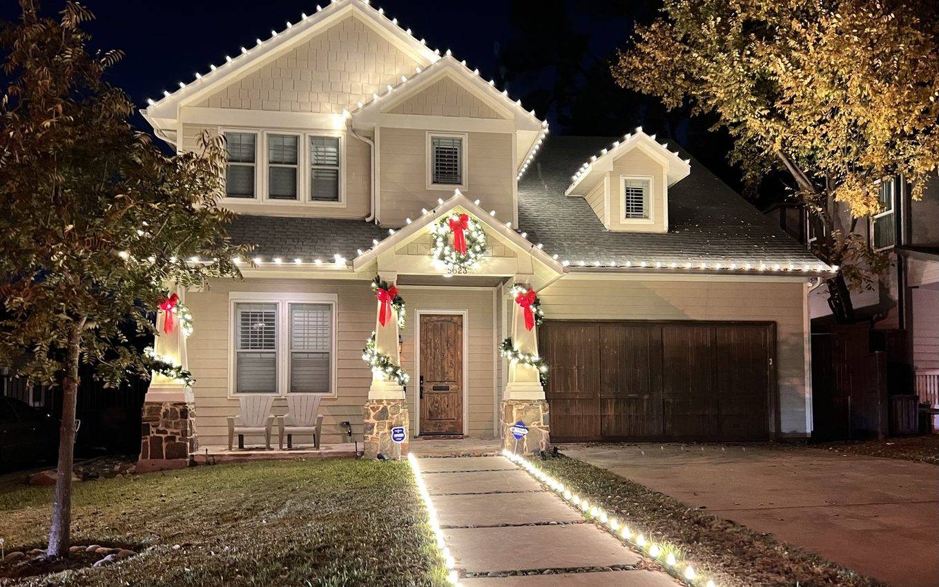 Highland Park Dallas home during Christmas light installation — daytime