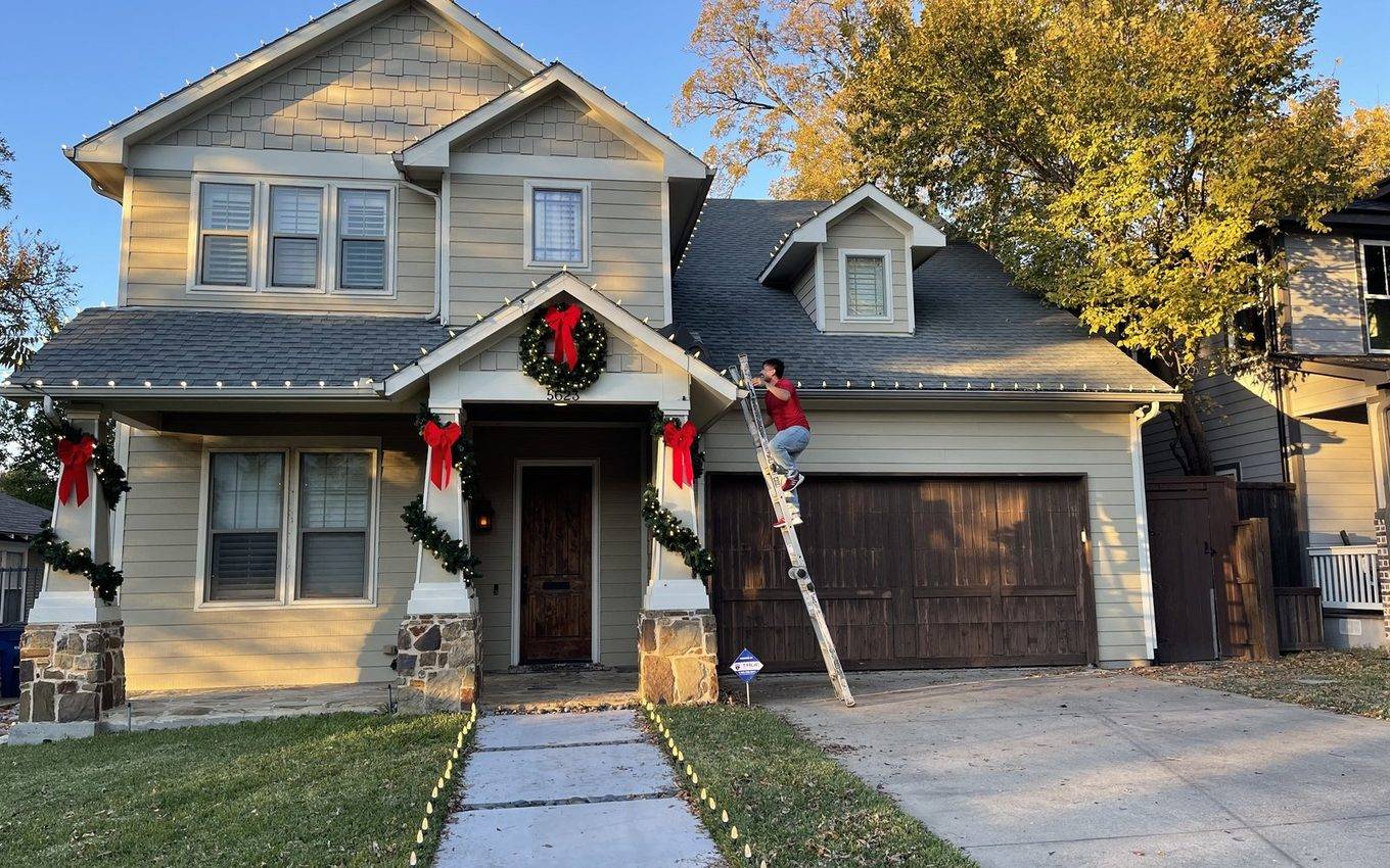 Highland Park Dallas home after professional Christmas light installation — lit at night