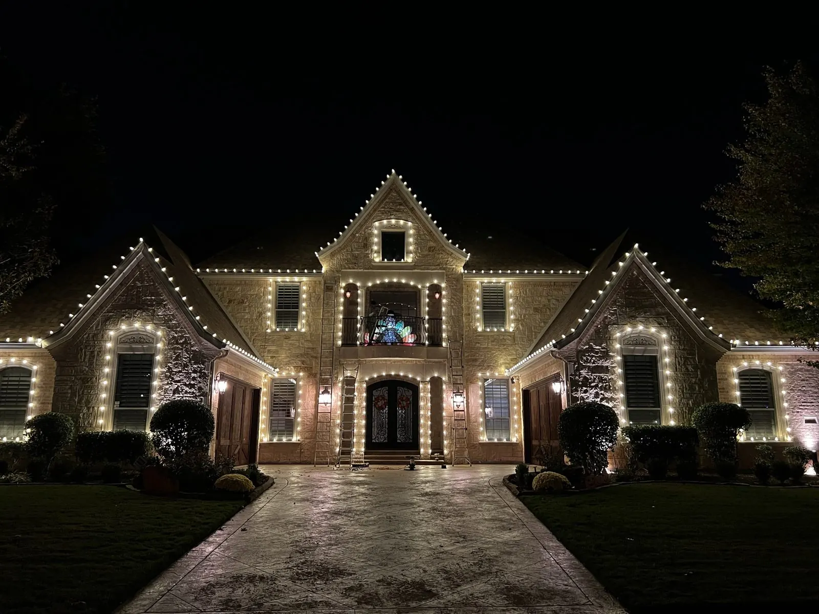 Christmas light installation on a Highland Park TX estate porch