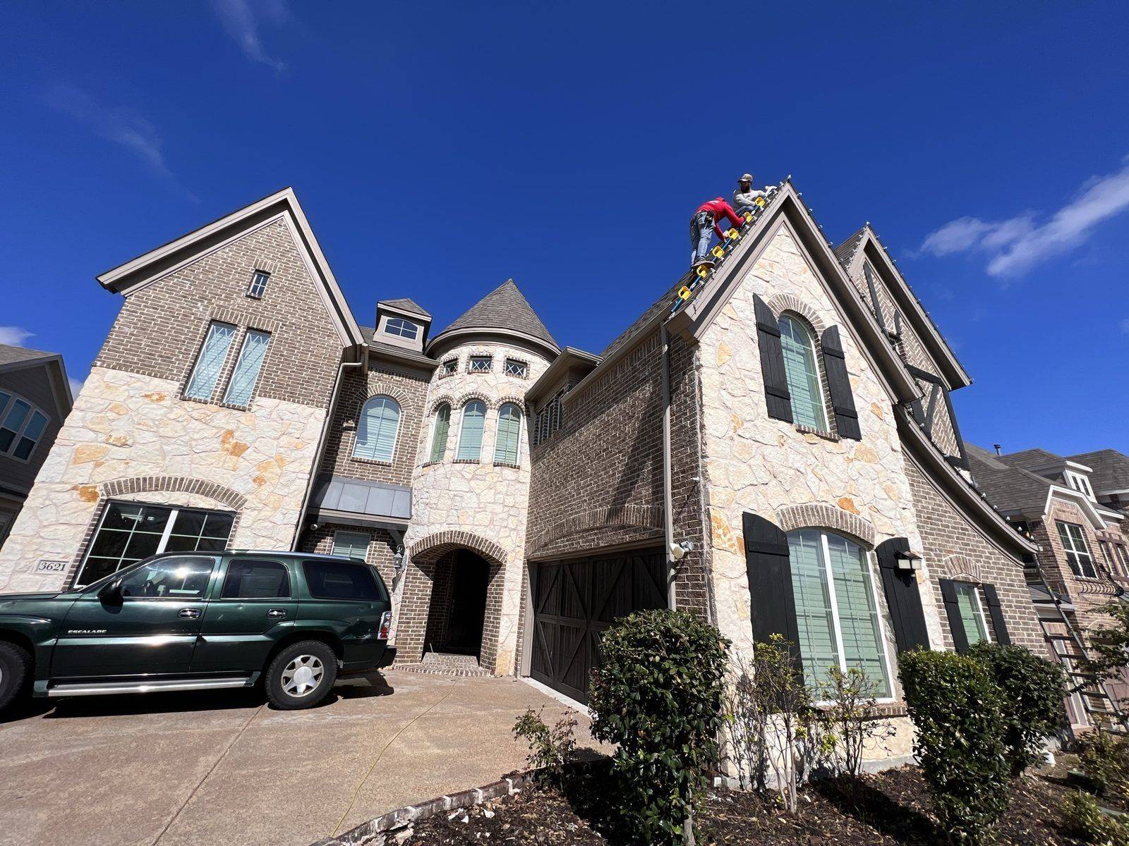 Christmas light installer climbing ladder Frisco TX castle Christmas light installer climbing ladder Frisco TX castle
