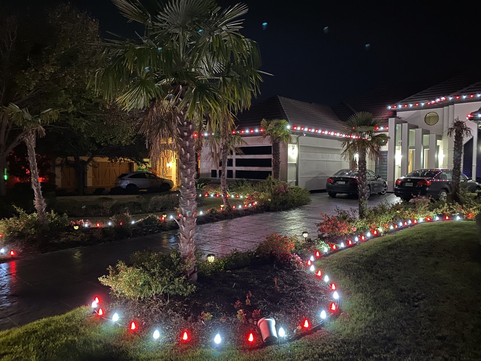 Christmas light installation Frisco TX — path and roofline lights on a stucco home