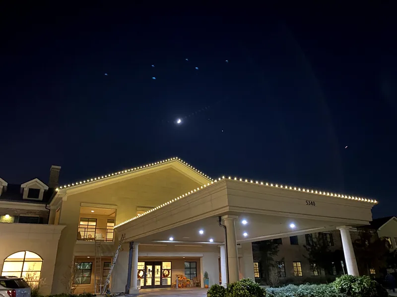 Commercial Christmas light installation DFW β warm white roofline on a corporate property at night