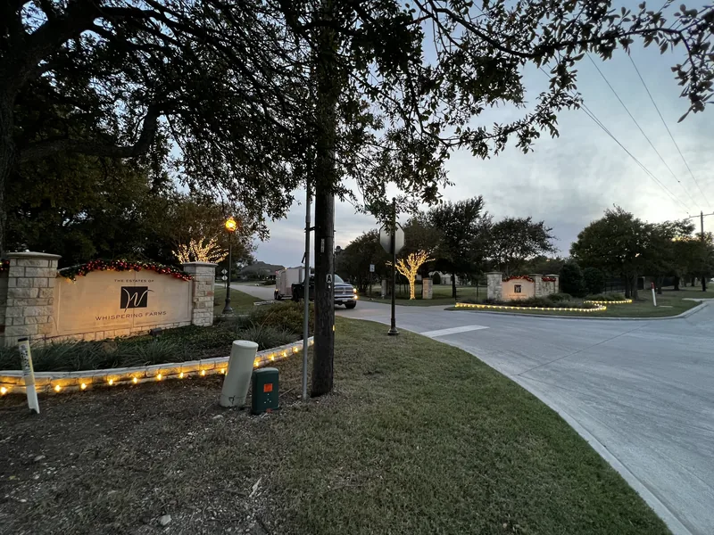 HOA Christmas light installation DFW โ holiday lighting on a community monument sign